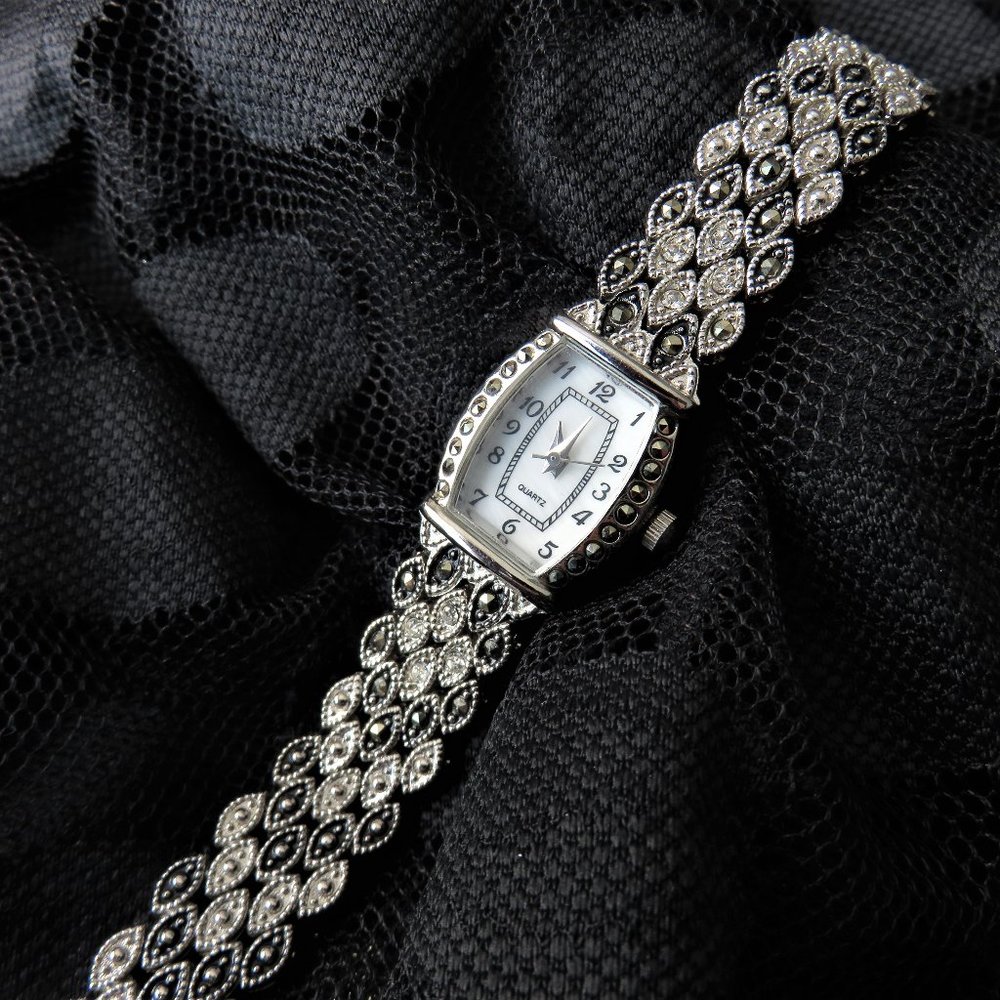 Silver and Black Quartz Watch...............726